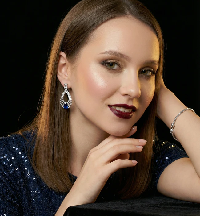 Sapphire drop earrings on model
